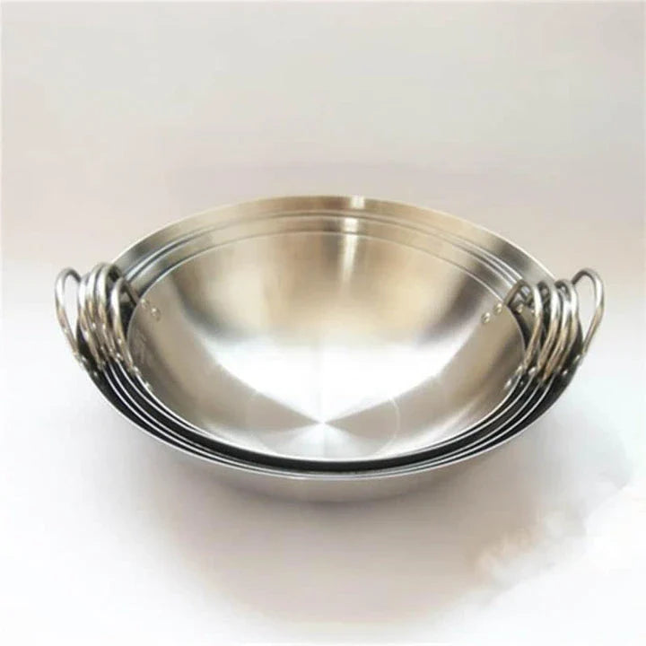 Premium British-made cast iron wok pan with superior heat retention and even heat distribution for versatile cooking