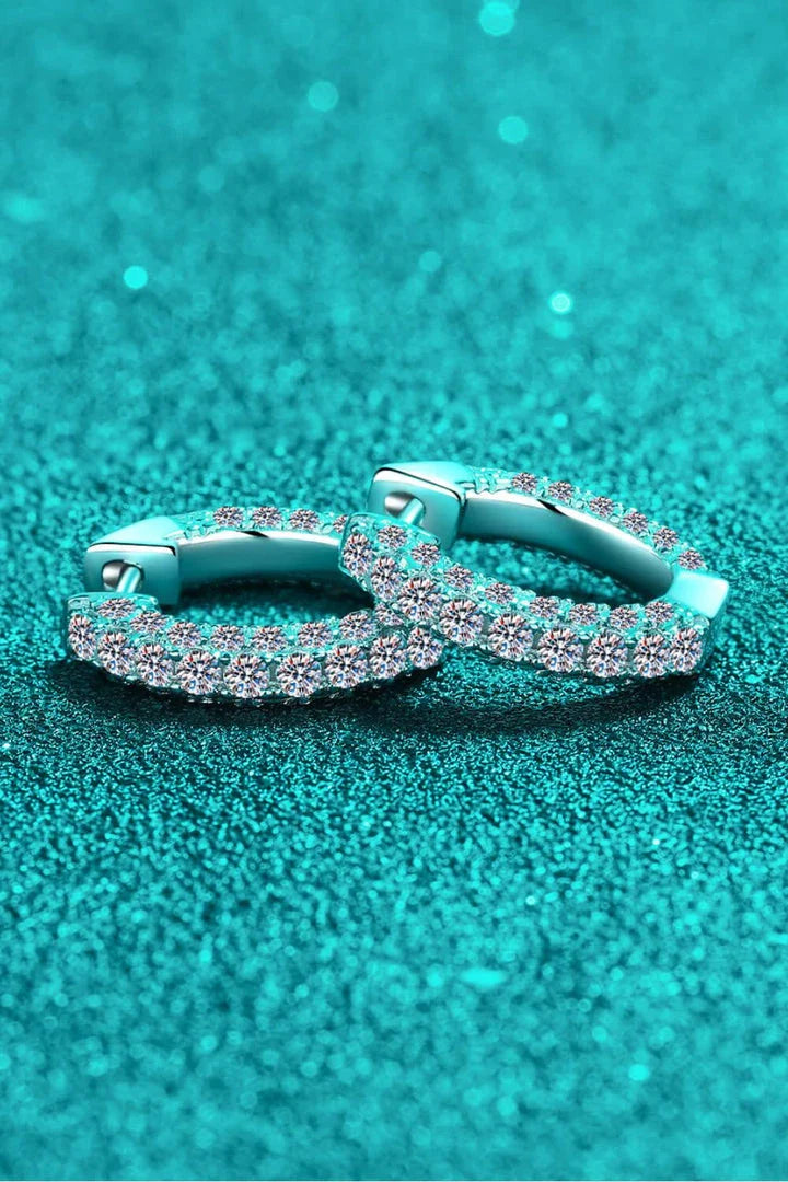 Elegant 925 sterling silver moissanite huggie earrings with a minimalist design and polished finish