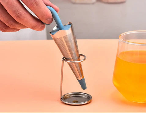 Silicone and stainless steel tea strainer with an umbrella-inspired design, available in various colours