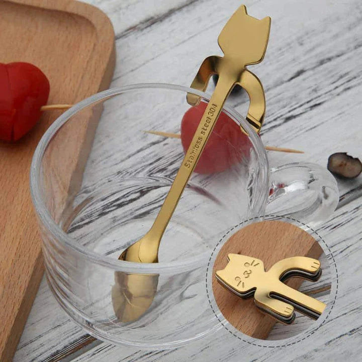 A silver cat-shaped stainless steel coffee spoon with a polished finish