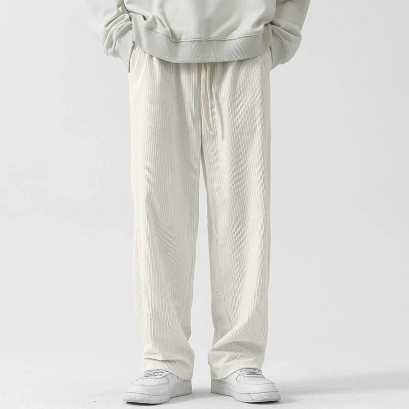 Premium fleece-lined corduroy trousers in a range of versatile colours, featuring a relaxed, straight-leg silhouette for a sophisticated, comfortable look.
