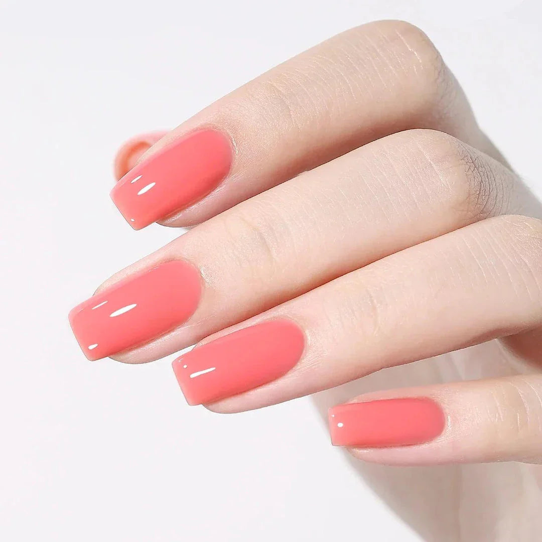 Vibrant jelly strawberry gel nail polish in a 10ml bottle, providing long-lasting, chip-resistant wear for professional-quality nails at home.