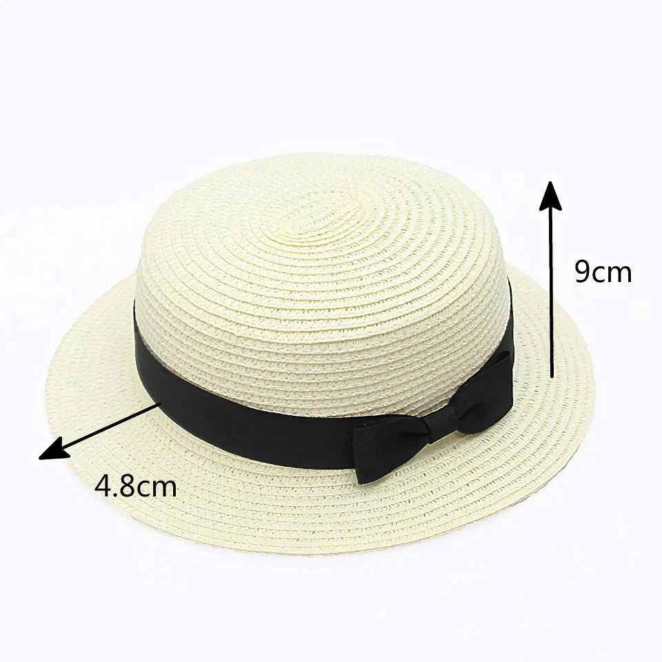 A classic summer Panama hat made from straw and paper, featuring a charming bow detail that adds a feminine touch.