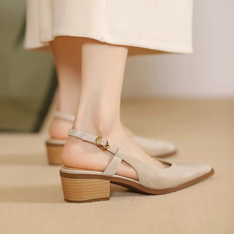 Elegant slingback leather pumps with a stylish mule design, secure buckle closure, and 4cm square heel