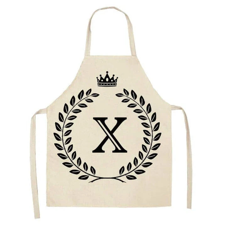 A high-quality kitchen apron featuring a charming crown and letter print design in a premium cotton and linen blend fabric.