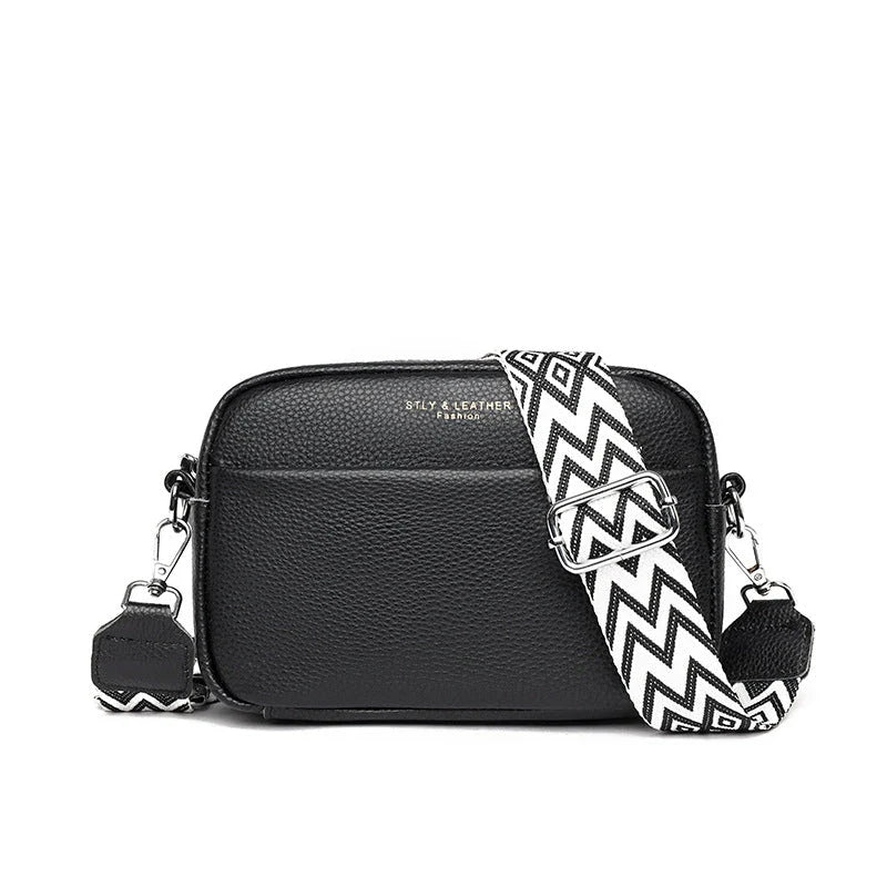 Stylish leather crossbody bag with embroidered strap in various colours