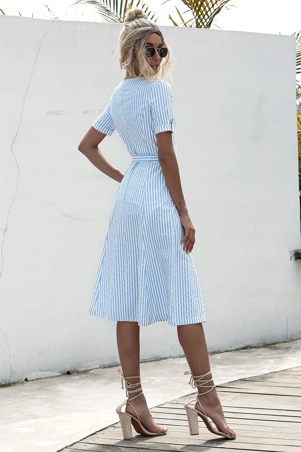 Stylish lace-up button dress in a soft, breathable cotton-blend fabric with a flattering middle waist silhouette