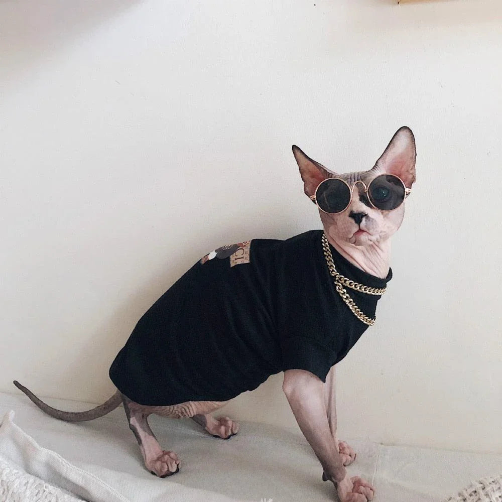 A stylish cotton sweater with a vibrant printed design and a coordinating necklace accessory, perfect for keeping your cat warm and fashionable.