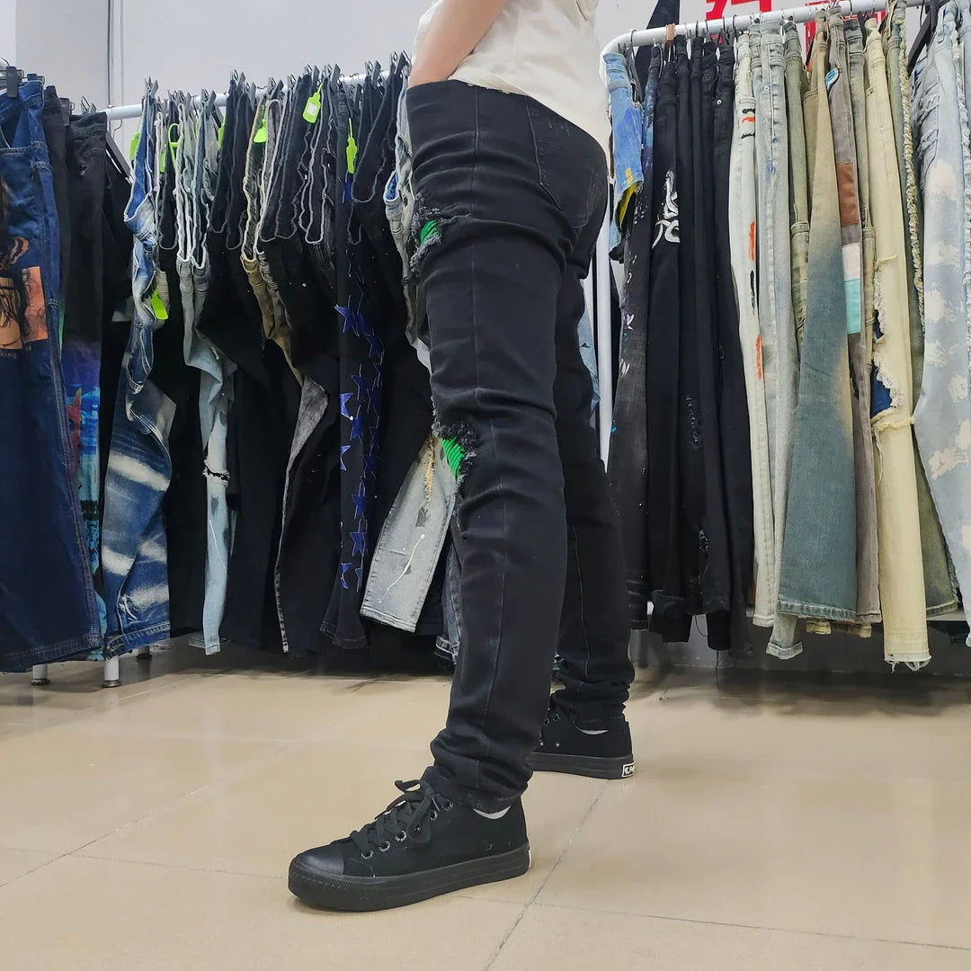 Premium ripped black jeans with stylish green patchwork design, made with medium-elastic fabric for comfort and a slim, flattering silhouette.