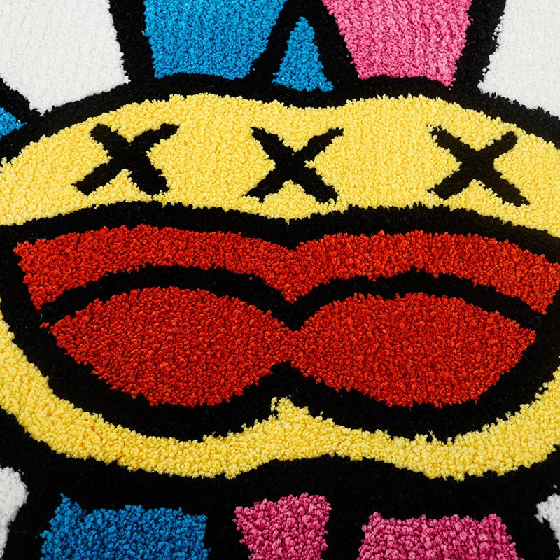 Cheerful smiling face tufted carpet in pink and blue colours, a plush and comfortable home decor item