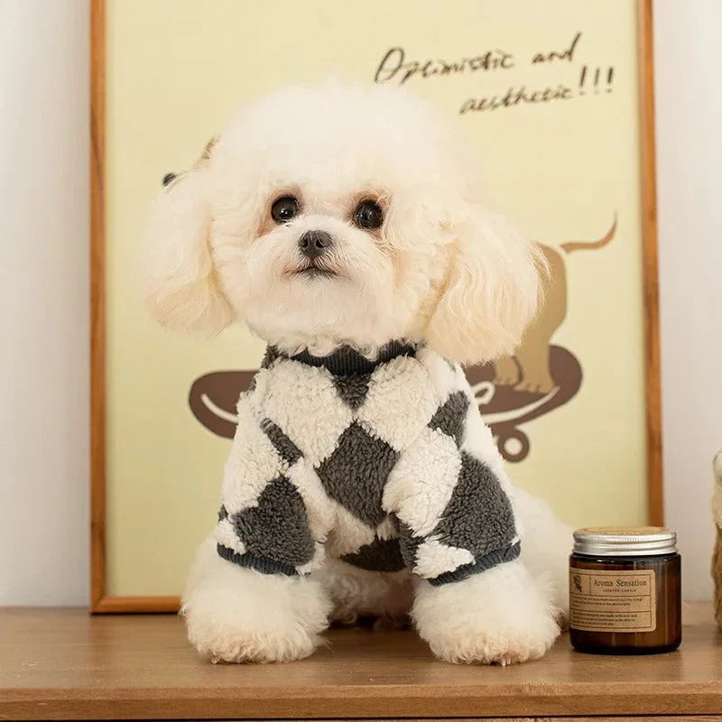A stylish checkered fleece coat for small and medium-sized dogs, providing warmth and comfort during the chilly British autumn and winter seasons.