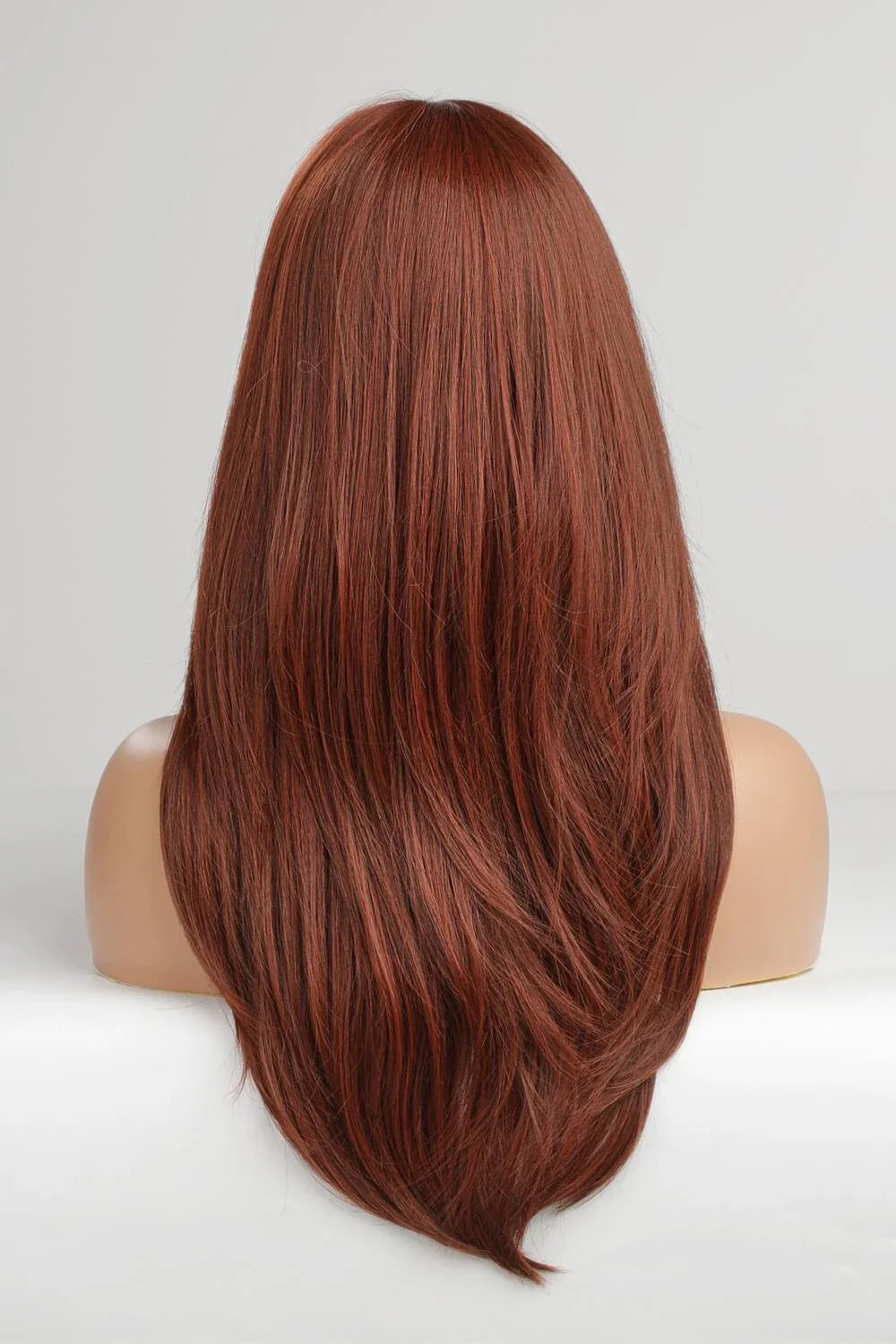 Luxurious mid-length wave synthetic wigs in 20-inch length, featuring a natural and sophisticated look for versatile styling