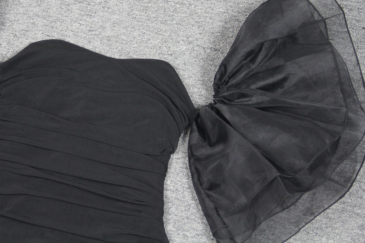Elegant puff sleeve mesh dress with a flattering short, irregular skirt in white and black colours