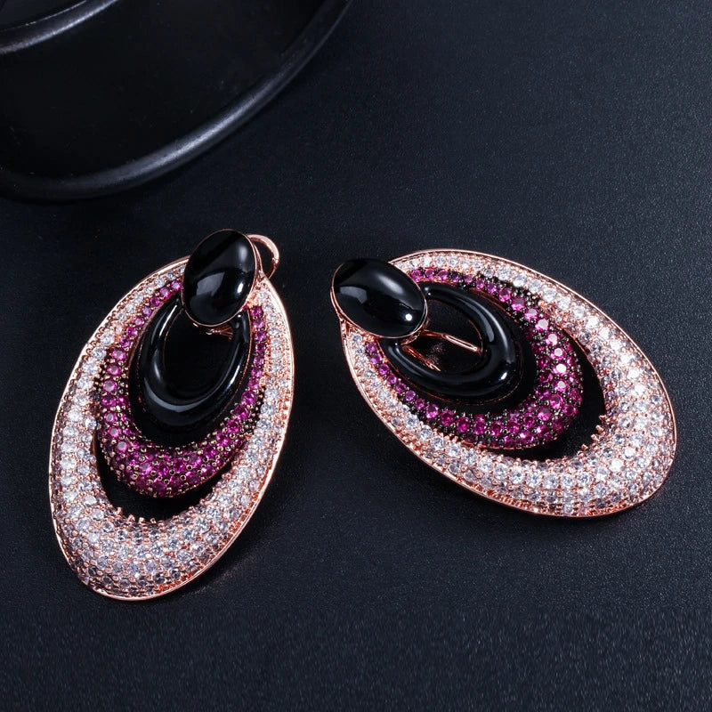 Elegant water drop-shaped ear studs in a vibrant red hue, adorned with a micro-inlaid zircon gemstone for a dazzling, sophisticated look.