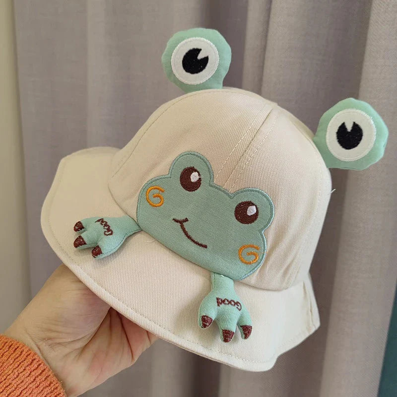 Charming frog-themed baby sun hat made from soft, breathable cotton with UPF 50+ sun protection