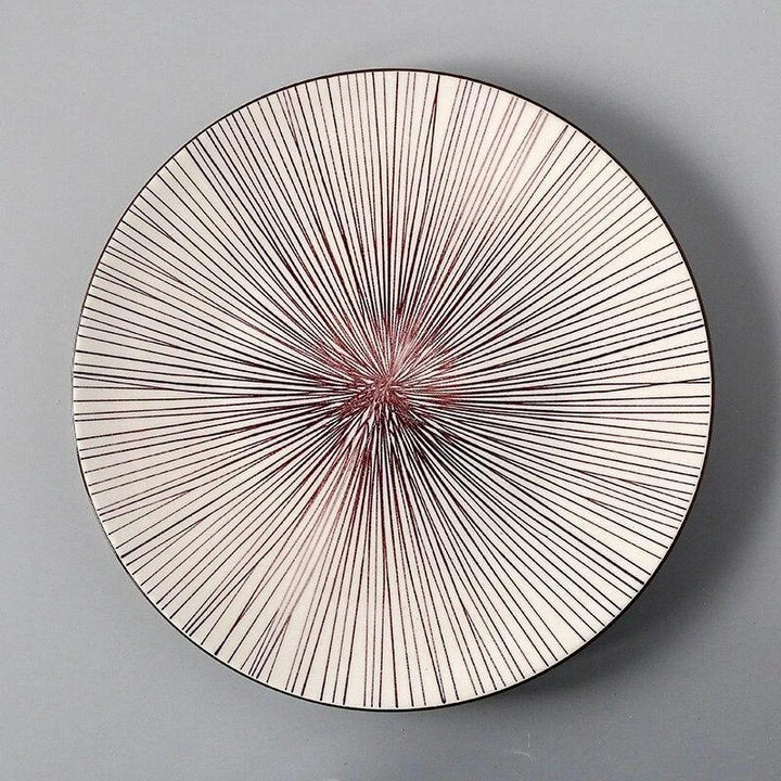 Elegant ceramic plates with vibrant, whimsical prints in a variety of enchanting designs