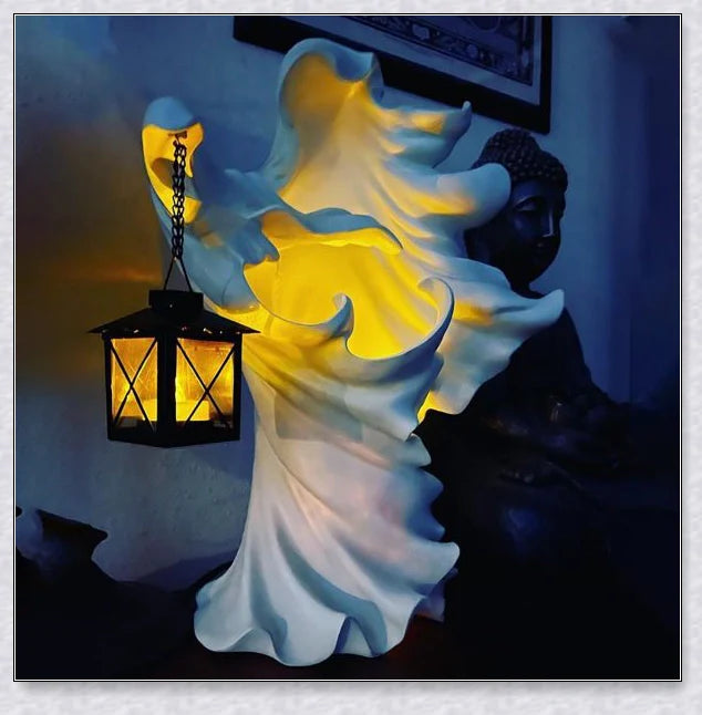 Chillingly elegant Halloween witch/ghost resin statue with eerie illumination, a unique blend of spooky charm and refined artistry for unforgettable seasonal decor