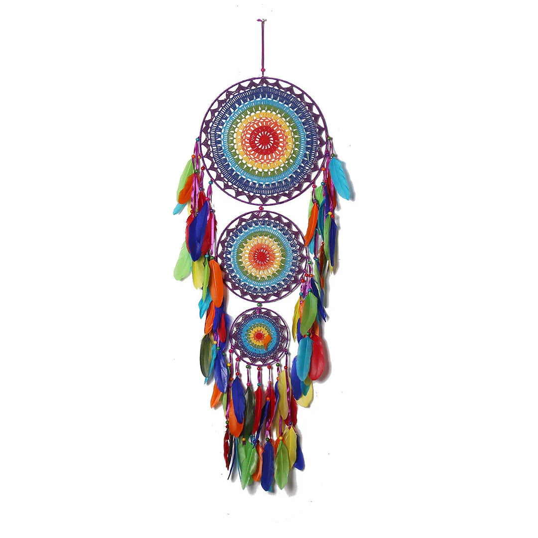 Colourful three-ring dreamcatcher wall hanging with feathers and beads, a unique and eye-catching home decor accent