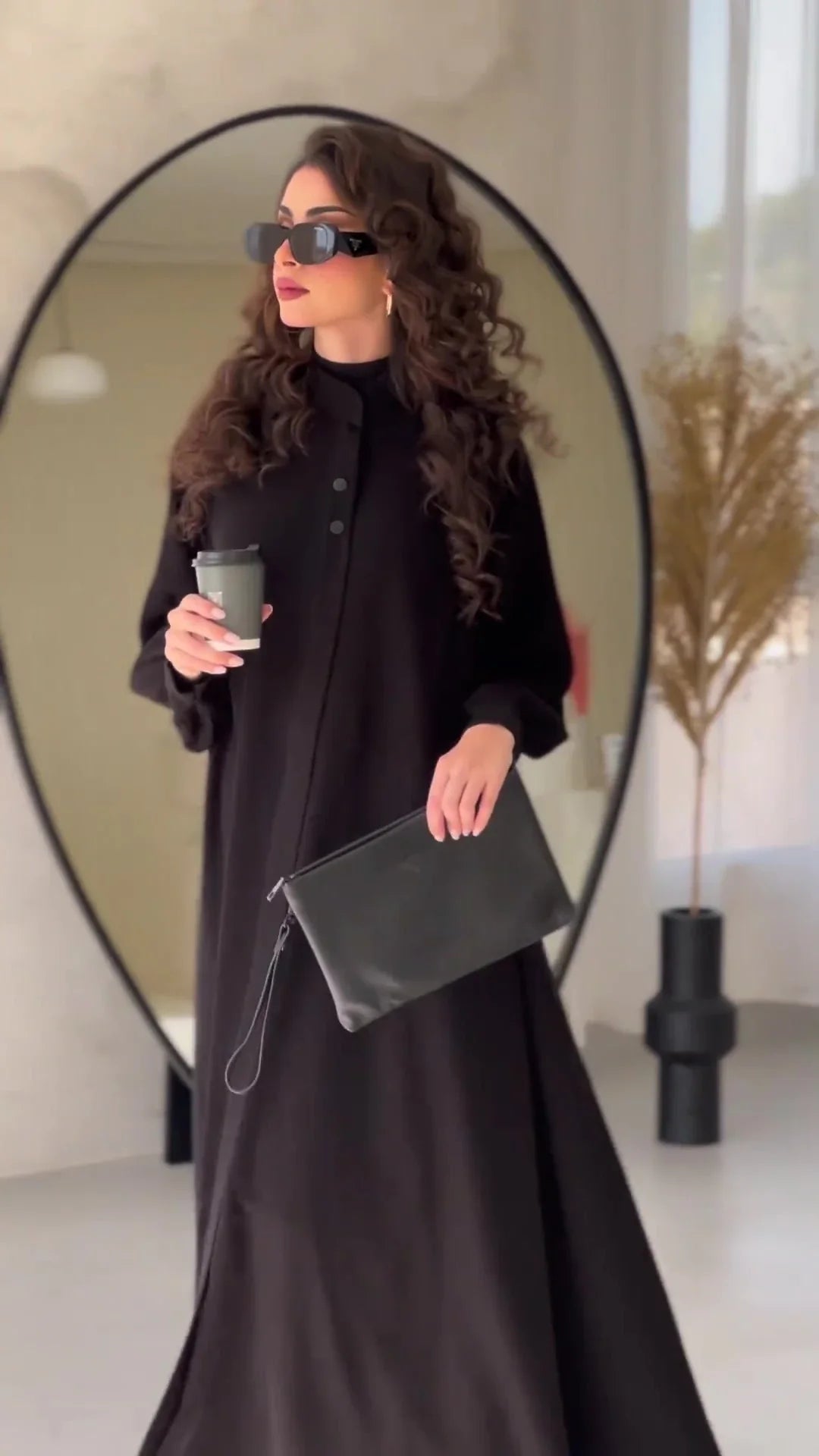 Premium black commuter swing skirt dress with long sleeves and an elegant A-line silhouette