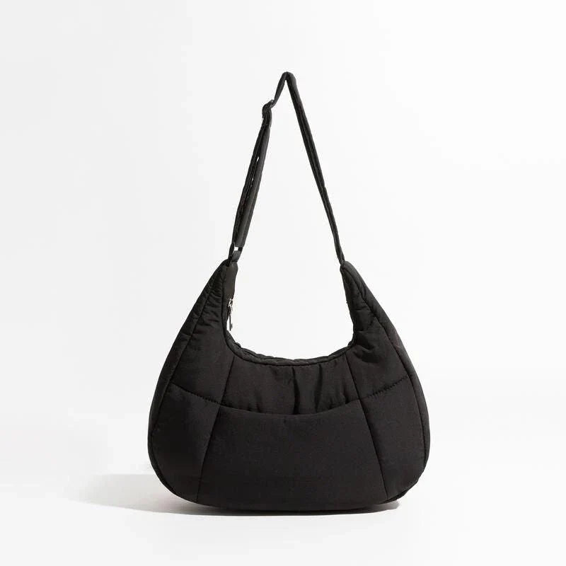 Chic Half Moon Puffer Shoulder Bag in a stylish pink colour, featuring a unique design and practical features for the modern woman.