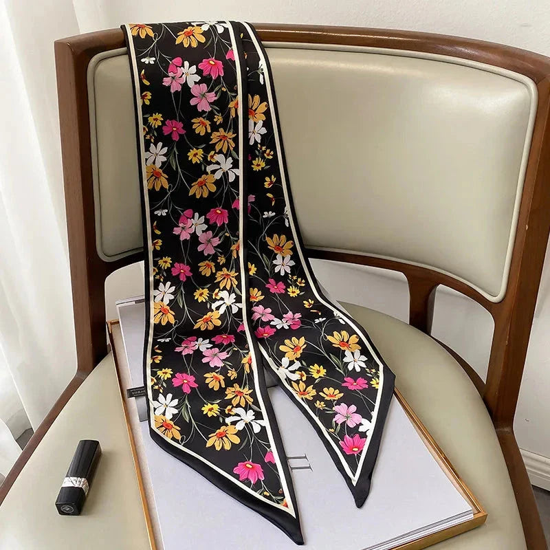 Elegant floral print polyester scarf with a soft, cotton-like texture for versatile seasonal wear