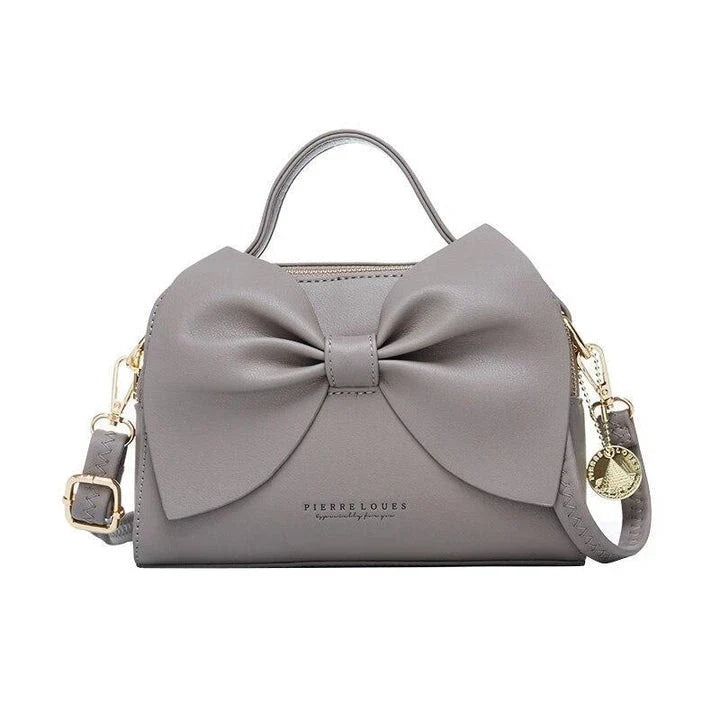 Elegant brown Korean-inspired bow shoulder bag with adjustable strap and roomy interior