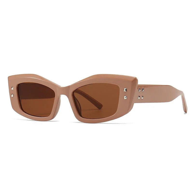 Retro cat eye sunglasses with rivet details, offering a stylish and protective eyewear solution.