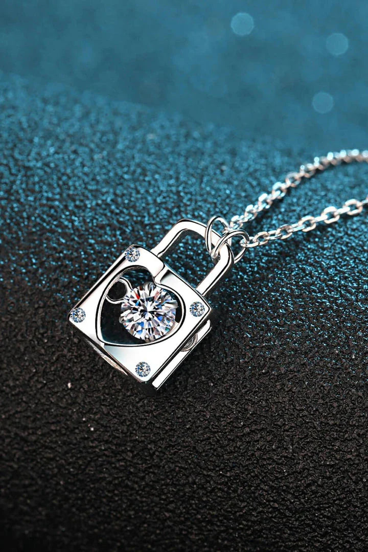 Elegant sterling silver moissanite lock pendant necklace with a minimalist, modern design
