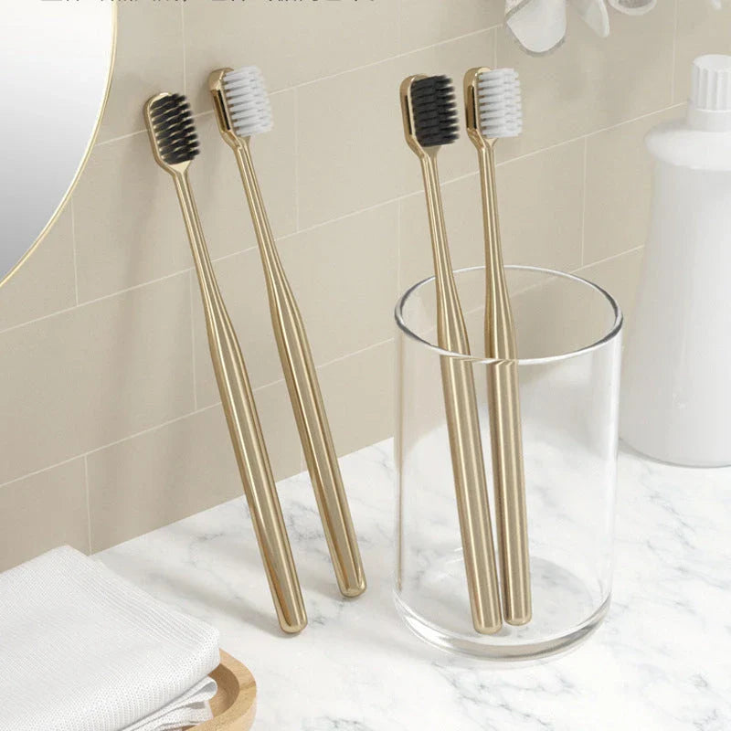 Elegant gold and silver toothbrush with soft bristles for superior dental hygiene