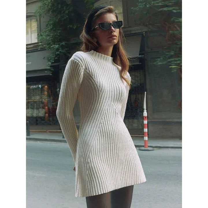 Elegant knitted mini dress with O-neck design, featuring long sleeves and a flattering sheath silhouette