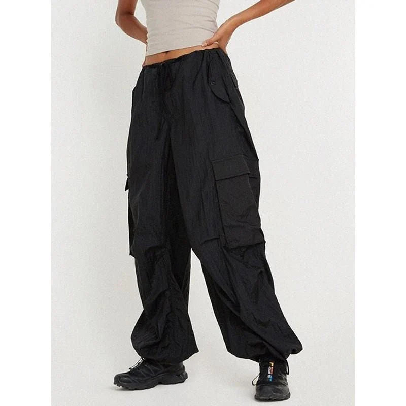 Stylish high-waist safari-inspired cargo trousers for women in black, featuring a comfortable, flattering fit and practical pockets.