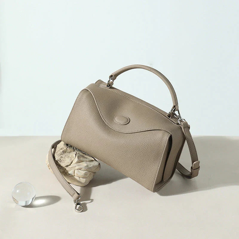 Premium British cowhide leather shoulder bag with multiple interior pockets and adjustable strap for versatile wear