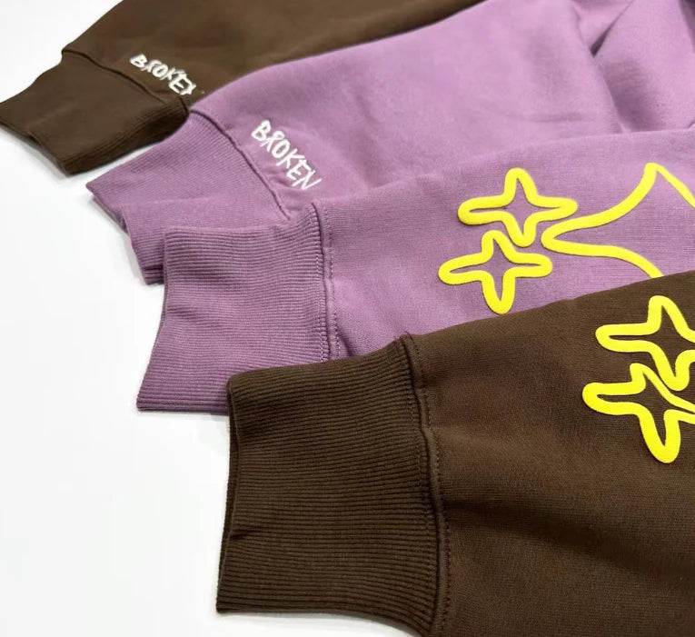 Trendha Two-Tone Hooded Sweatshirt with Star Print in Purple