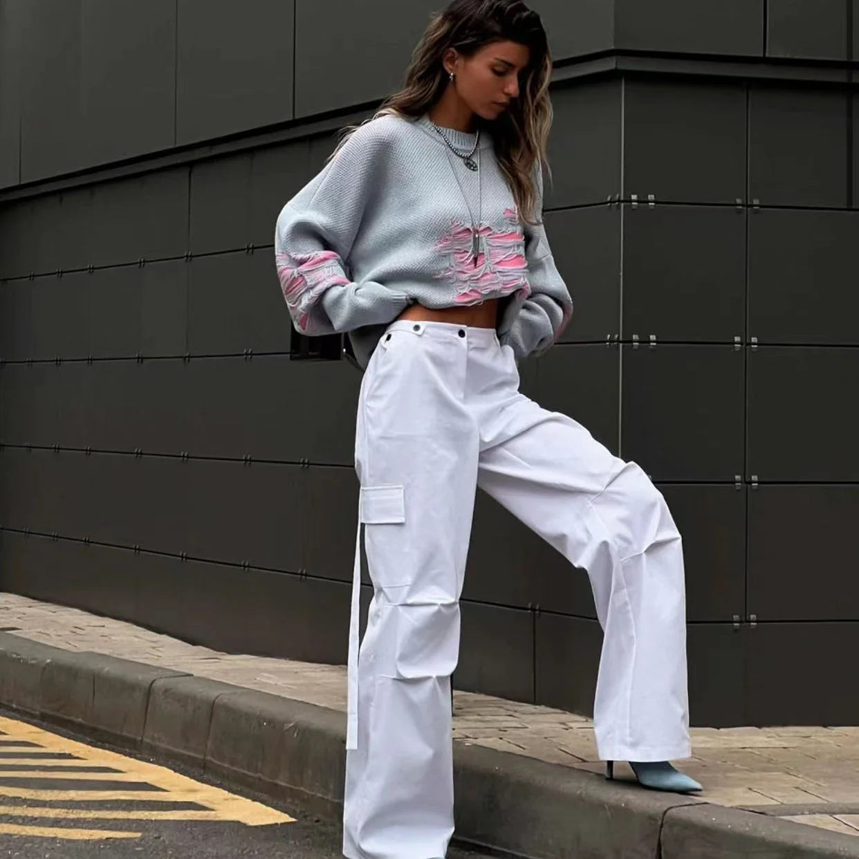 A stylish ripped long sleeve top in a variety of versatile colours, including grey, green, and black.