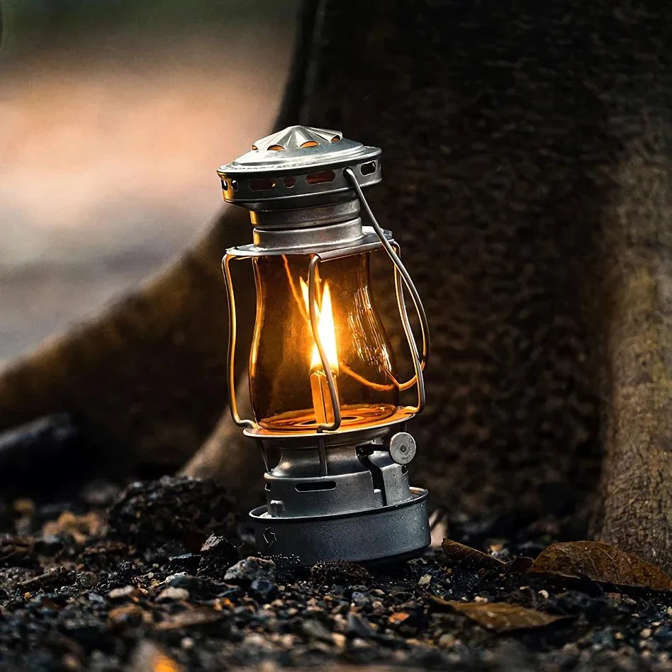 Classic vintage-inspired kerosene camping lamp with stainless steel construction and automatic ignition for reliable outdoor lighting