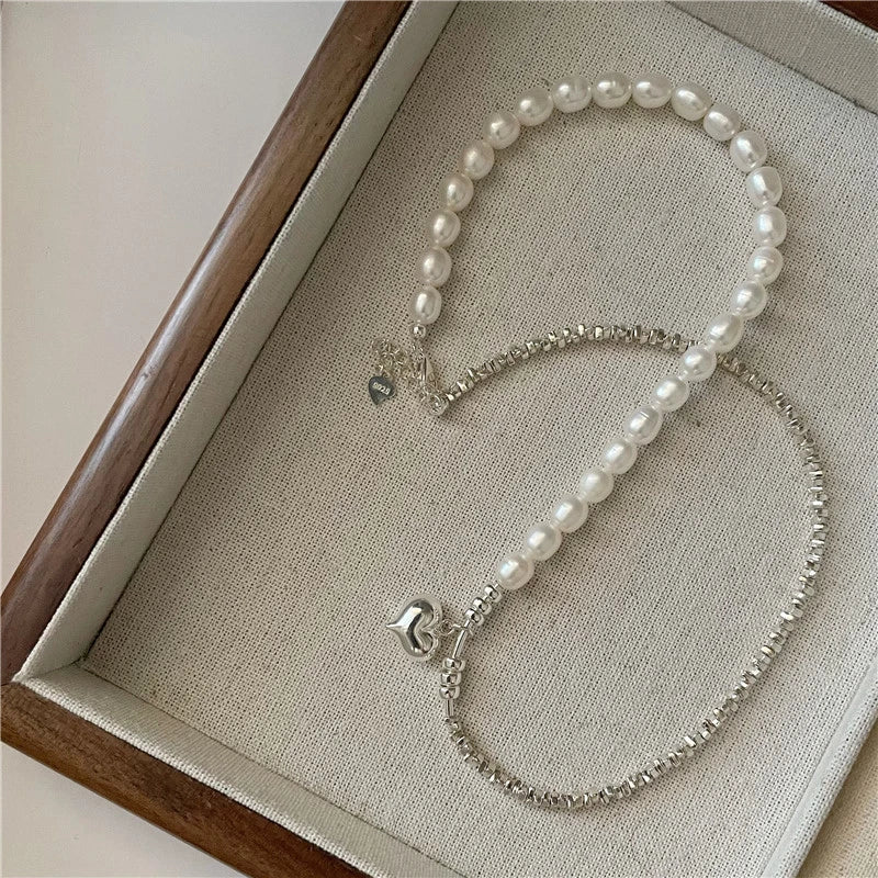 Elegant heart-shaped pearl necklace in sterling silver, a timeless British-inspired accessory