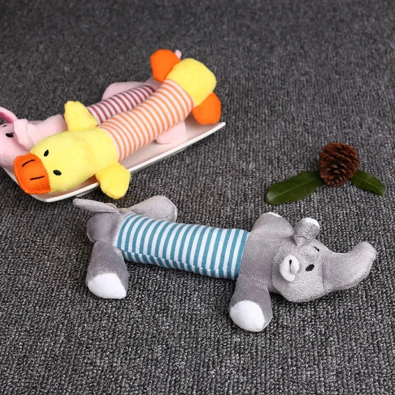 Premium plush squeaky dog toy in various colours, featuring textured stripes for dental cleaning and a built-in sound generator for interactive play.