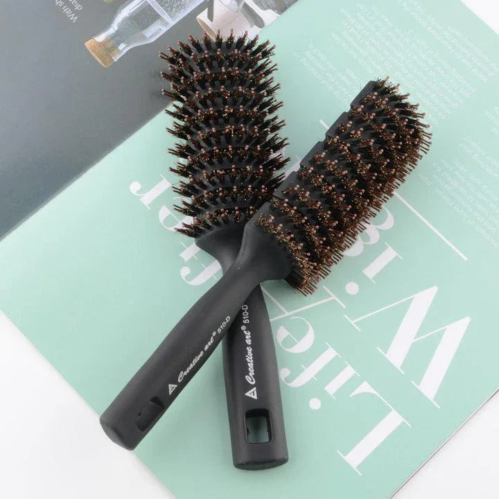 Premium black detangling hair brush with ergonomic long handle for smooth, tangle-free hair and healthy scalp
