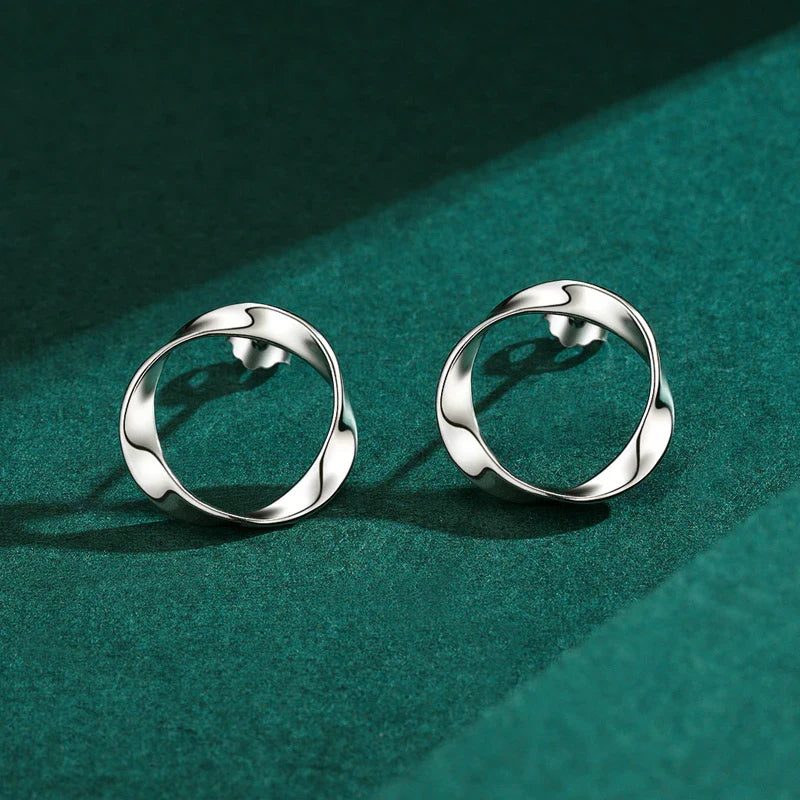 Stylish geometric silver earrings with an irregular circular design, crafted from premium 925 sterling silver for a modern, elegant look.