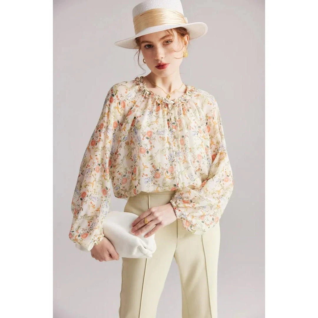 Floral silk blouse with ruffles and round neckline, showcasing the elegant and comfortable design for versatile wear.