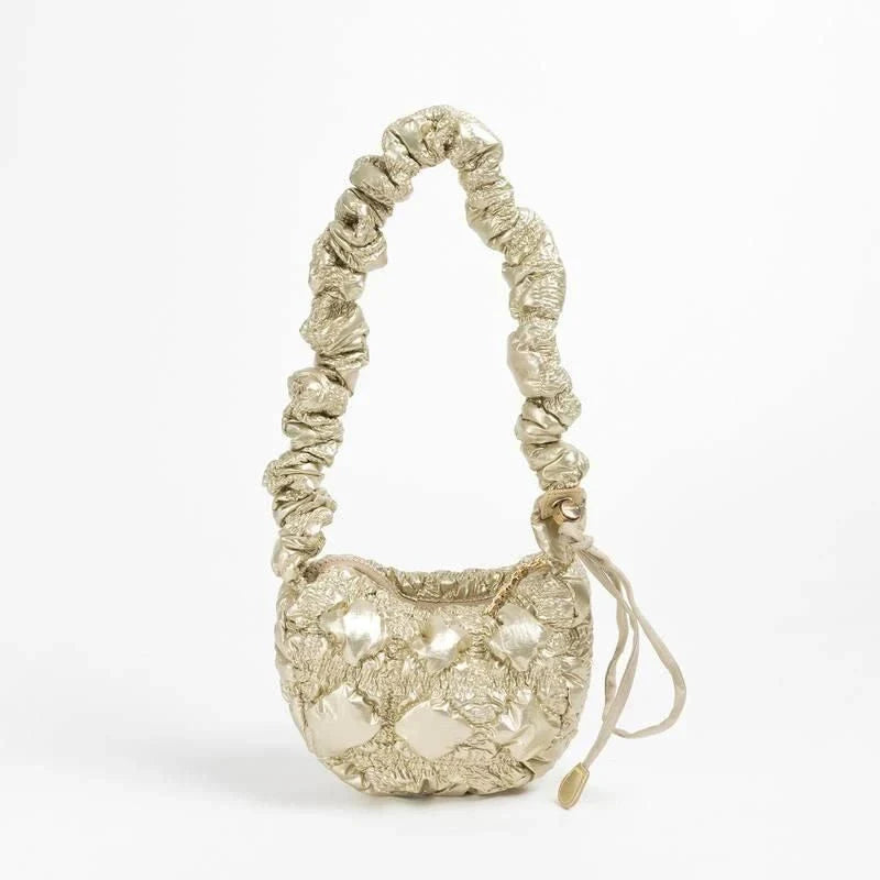 Stylish plaid quilted sling bag with adjustable strap for versatile shoulder or crossbody wear
