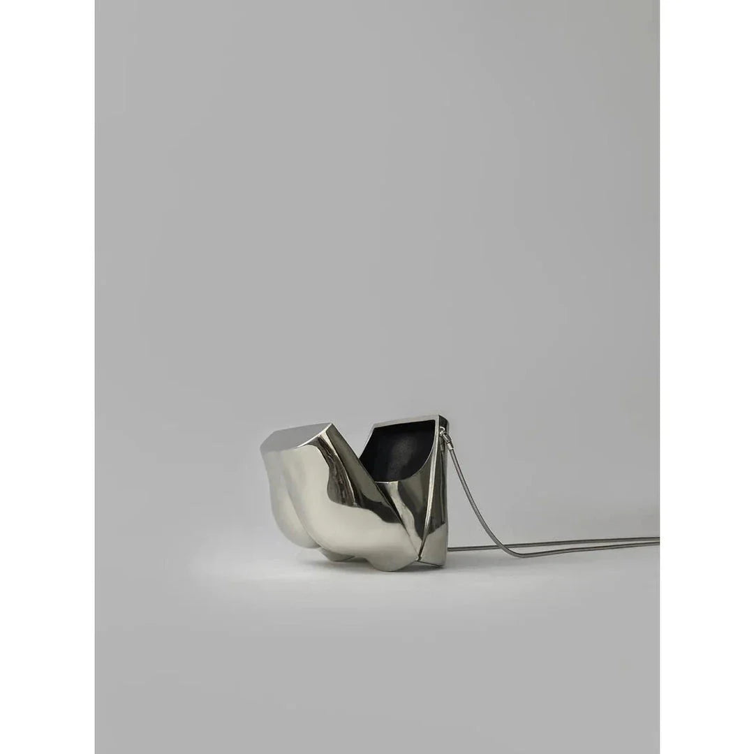 Elegant silver acrylic evening clutch bag with stylish chain strap for versatile carrying