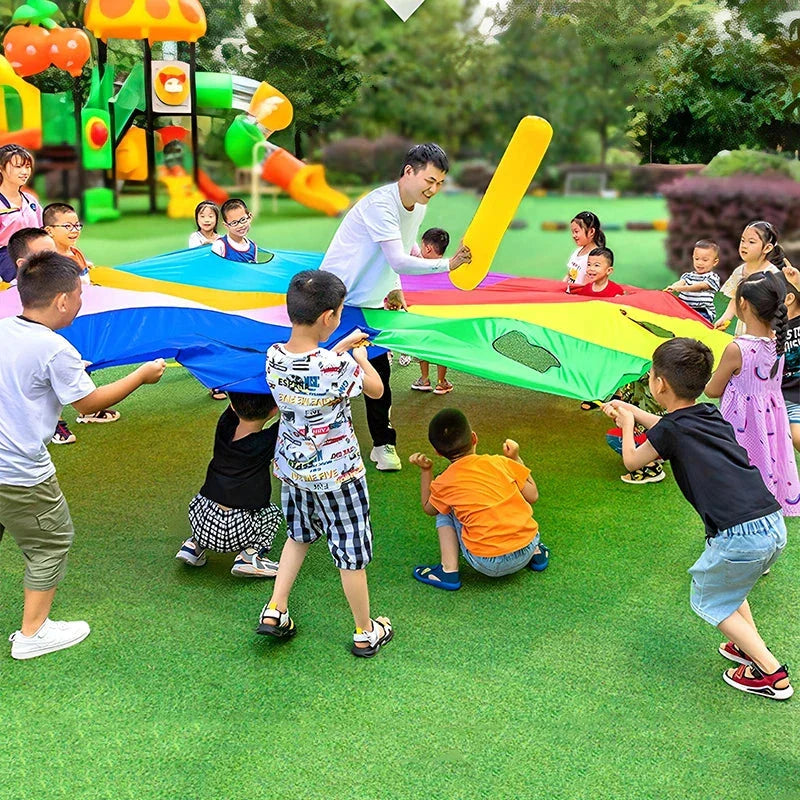 Vibrant rainbow-coloured parachute umbrella game for outdoor group activities and events