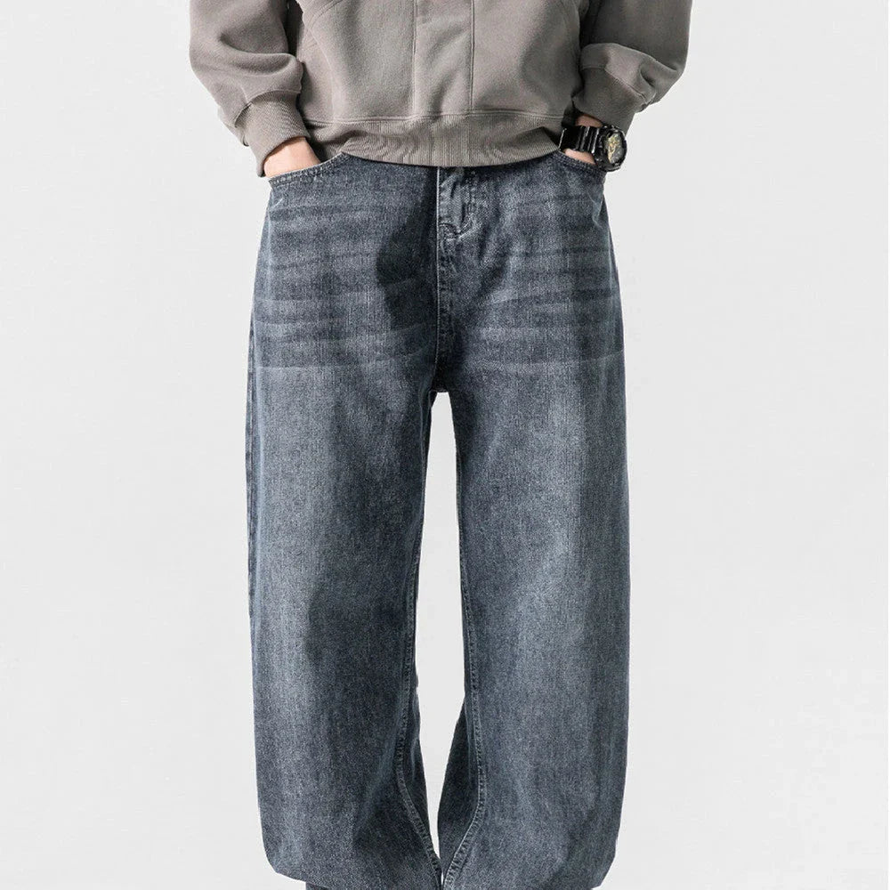 A pair of stylish retro-inspired Japanese jeans in black and grey, featuring a mid-rise waist and straight leg silhouette for a flattering, comfortable fit.