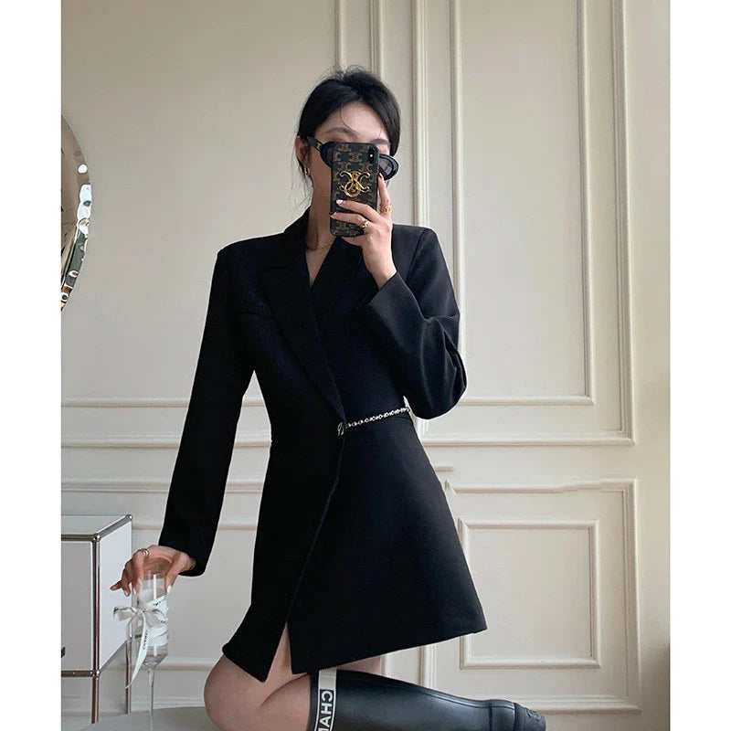 A sophisticated black polyester jacket with a sleek back chain design, perfect for elevating your British fashion style.