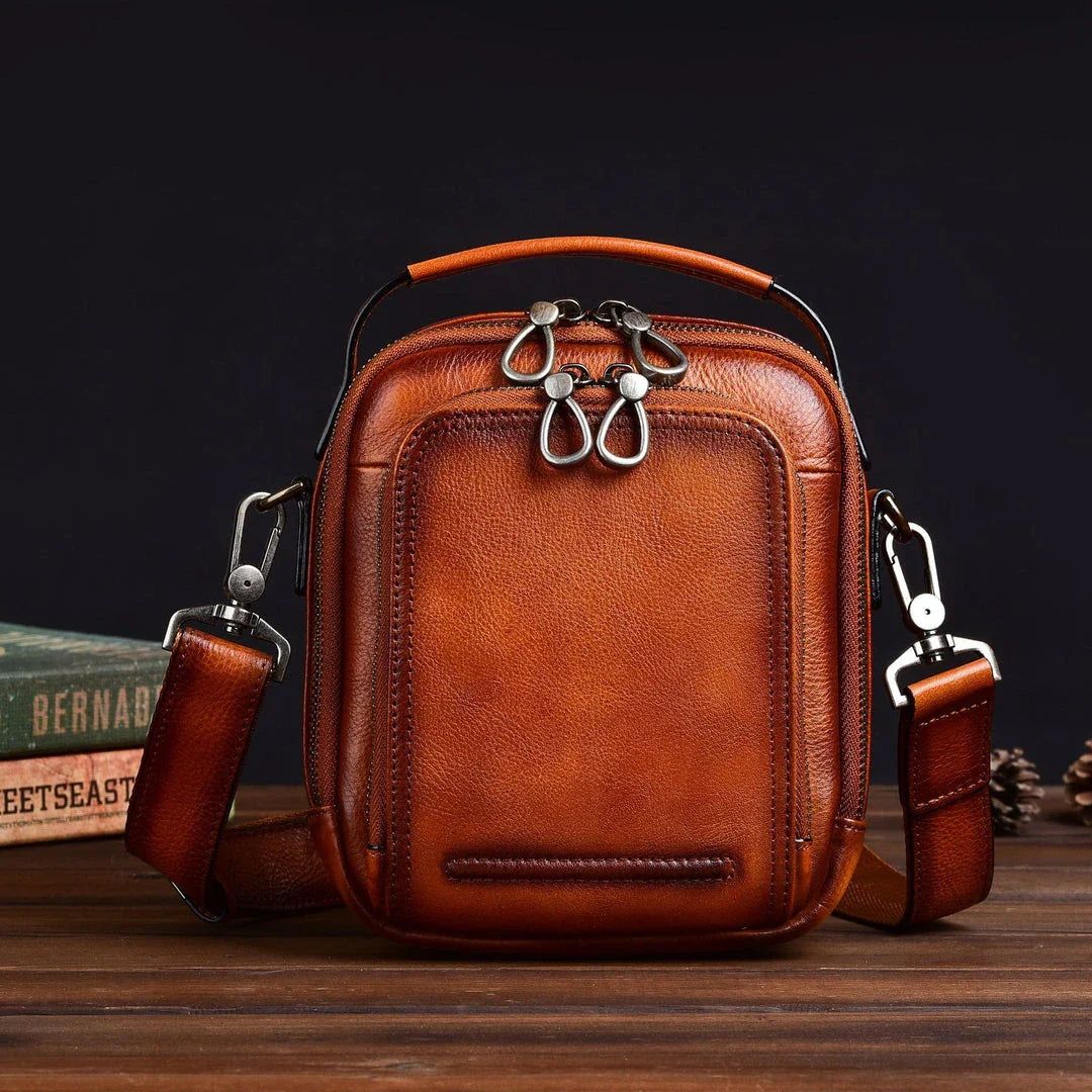 Premium retro leather messenger bag with spacious main compartment, side pockets, and robust handle for comfortable carrying
