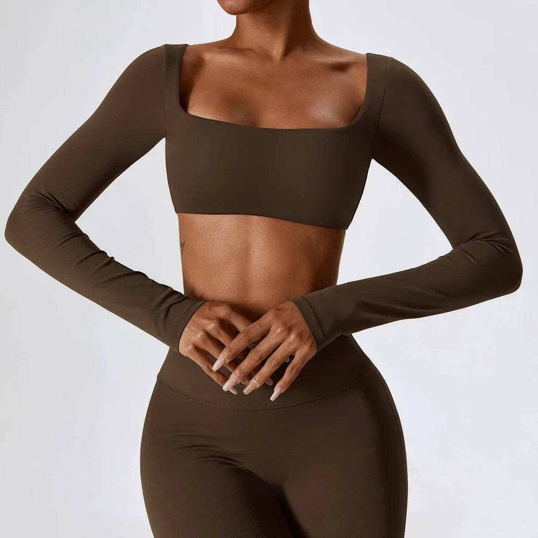 Stylish long sleeve crop top yoga shirt in green, designed for comfort and performance during workouts