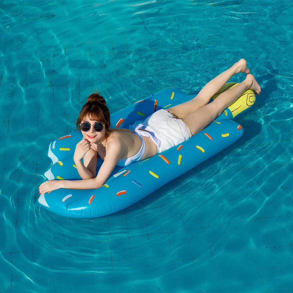 Premium inflatable swim float in a vibrant pink and blue ice cream design, providing comfortable and stylish relaxation on the water