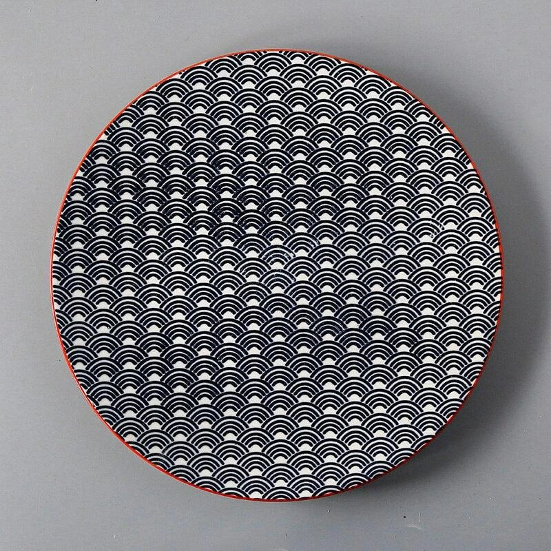 Elegant ceramic plates with vibrant, whimsical prints in a variety of enchanting designs