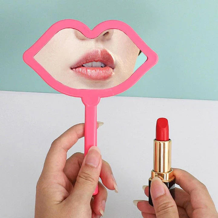 Lip-shaped handheld makeup mirror with a comfortable ergonomic handle for precise on-the-go touch-ups